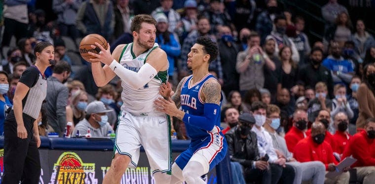 Dallas Mavericks guard Luka Doncic (77) is guarded by Philadelphia 76ers forward Danny Green (14) in a 2022 NBA contest