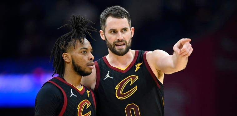 Darius Garland (10) and Kevin Love (0) discuss an earlier play during the Cavaliers thrashing of the Milwaukee Bucks at Rocket Mortgage Fieldhouse