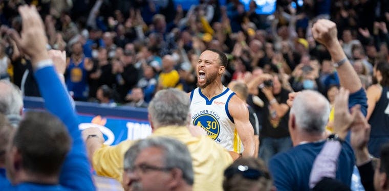 Golden State Warriors guard Stephen Curry celebrates during the fourth quarter of Game 4