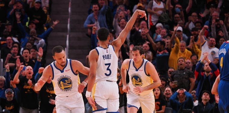 Warriors guard Jordan Poole holds his position after scoring a three point basket against the Denver Nuggets in the NBA Playoffs