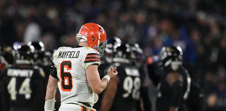Browns quarterback Baker Mayfield walks on to the field during the game against the Ravens