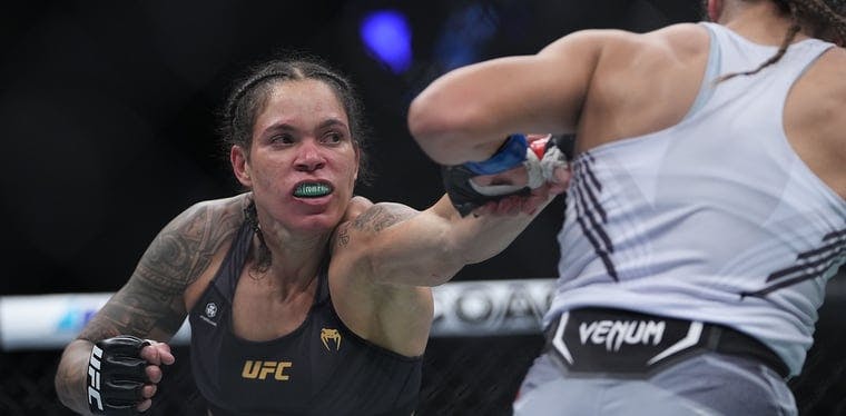 Amanda Nunes moves in with a hit against Julianna Pena during UFC 269