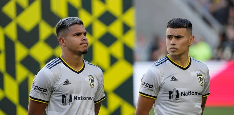 Crew forward Cucho Hernandez and Columbus Crew midfielder Lucas Zelarayan stand for the National Anthem