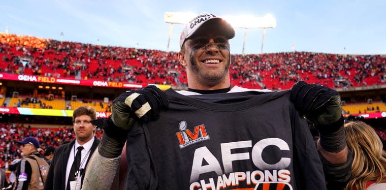 Sam Hubbard holds up the AFC Championship shirt in Kansas City after the Bengals stunned Kansas City in an overtime thriller.